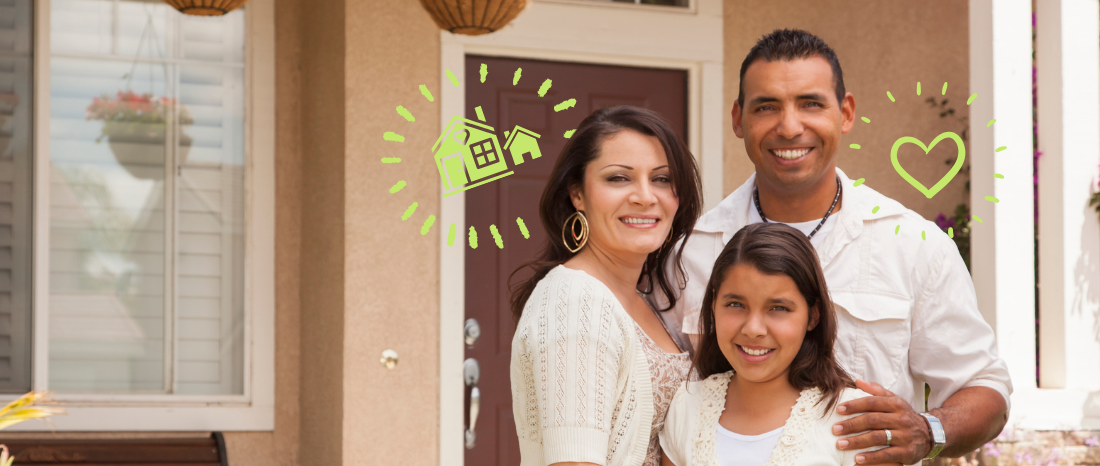 A family standing outside of their new home.
