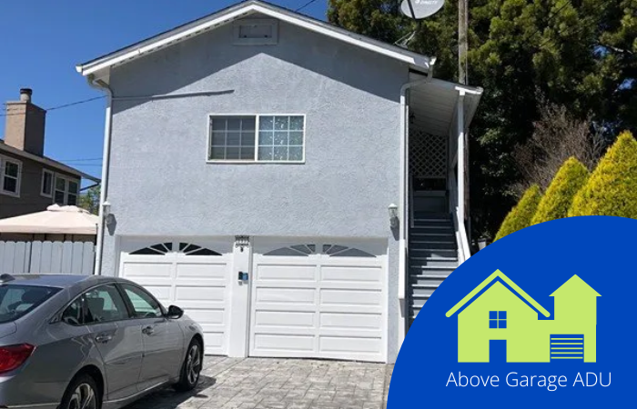 A car parked outside of a garage.